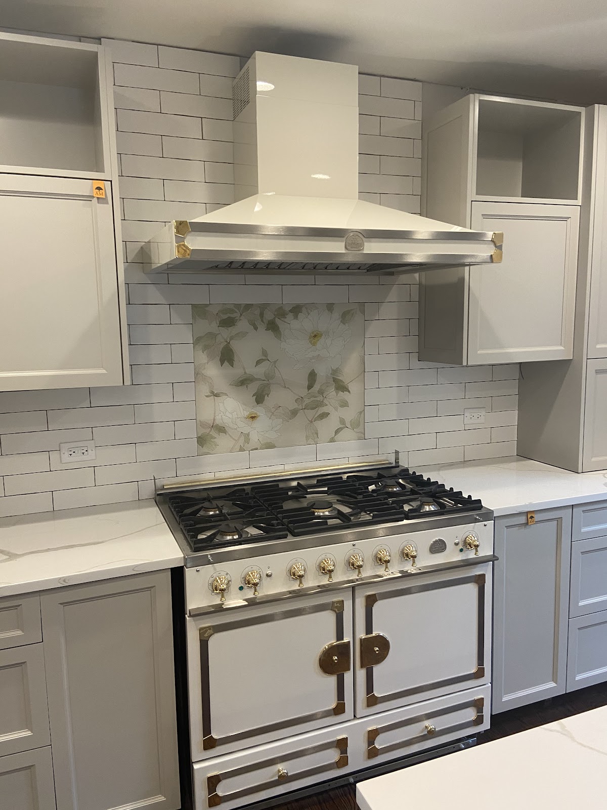 La Cornue range with custom hood and subway tile backsplash