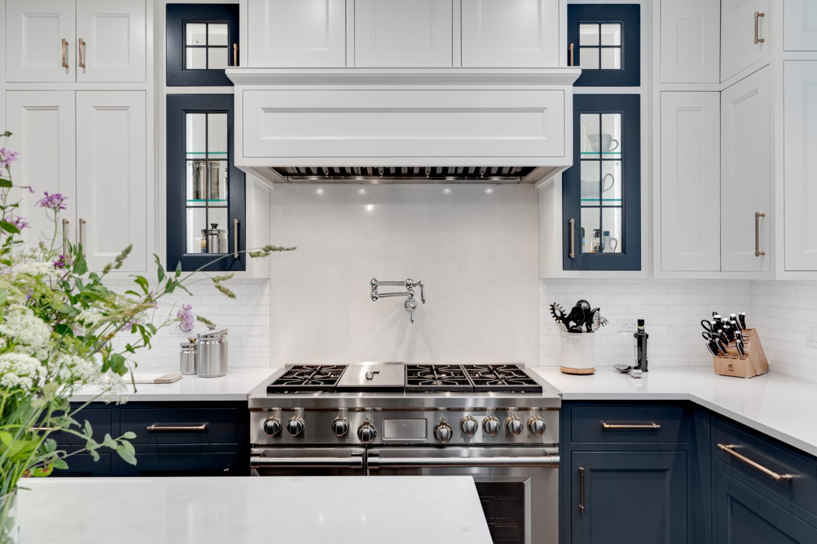 Kitchen remodel with navy and white custom cabinetry
